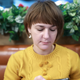 Illustration for article titled Kinda Taking A While: This Woman Is Clearly Still Scrolling To Find An Acceptable Picture Of The New Guy She’s Dating To Show Her Friends